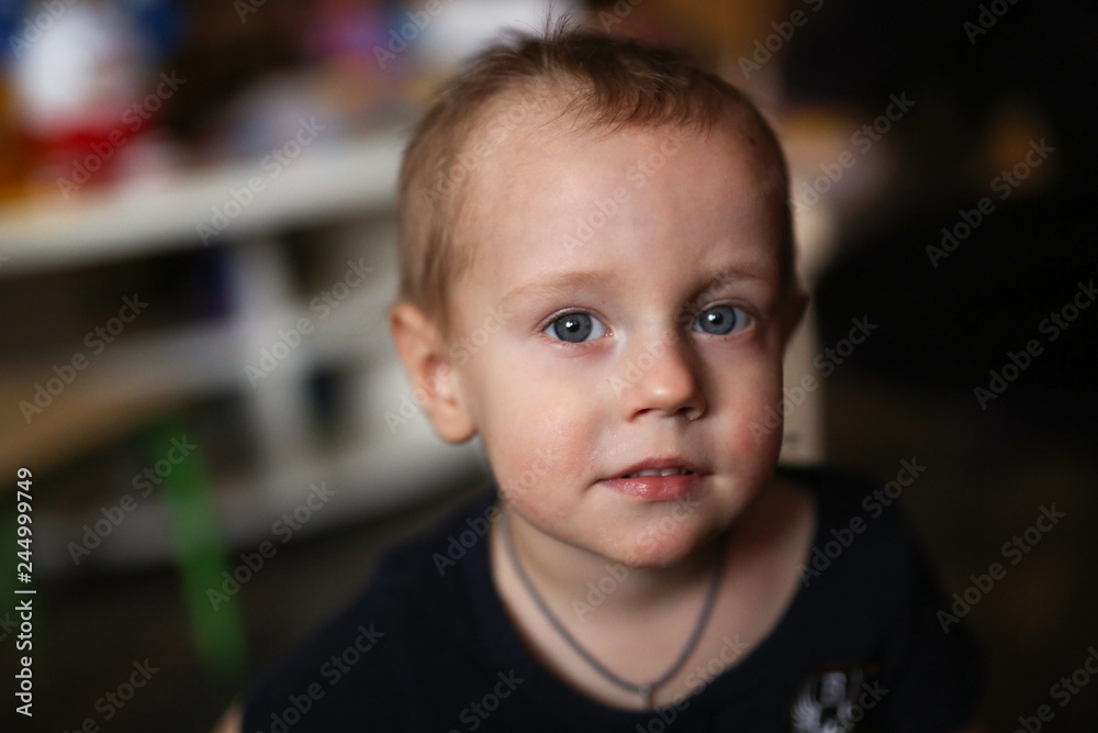 smiling Toddler boy, closeup portrait on dark smiling Toddler boy, closeup portrait on dark