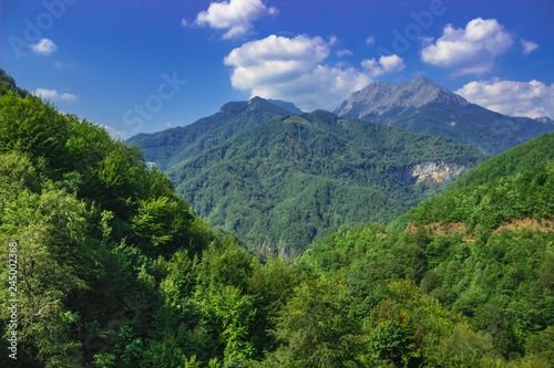 Mountain landscape in the summer cloudy day. Soft focus and blurred background.