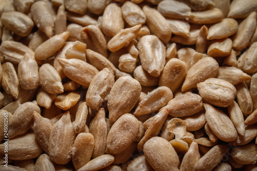 Peeled, roasted and salted sunflower seeds. Macro close-up photography.