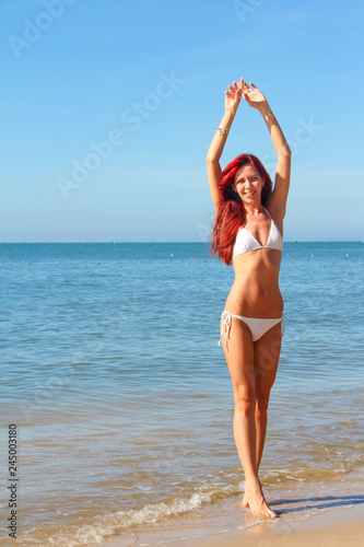 Woman walks on the beach © destillat