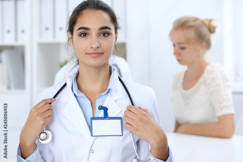 Portrait of young doctor woman in hospital. Hispanic or latin american staff in medicine. Patient service concept Portrait of young doctor woman in hospital. Hispanic or latin american staff in medicine. Patient service concept