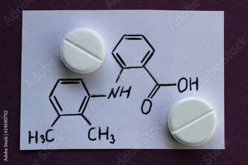 A tablets of Mefenamic acid, which stimulates the production of interferon, and acts as an antipyretic and antiviral drug. photo