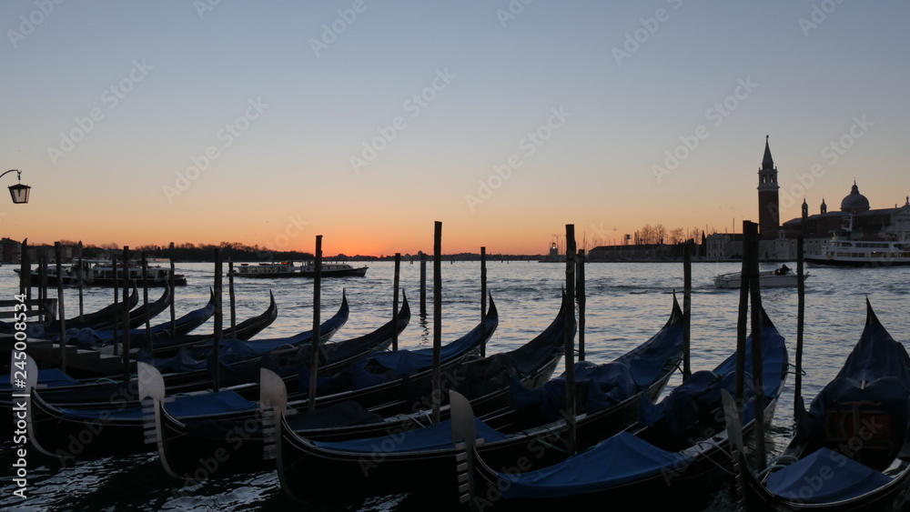 Venice Sunrise with nobody, Black Gondola and Golden Sun Light over the Grand Canal