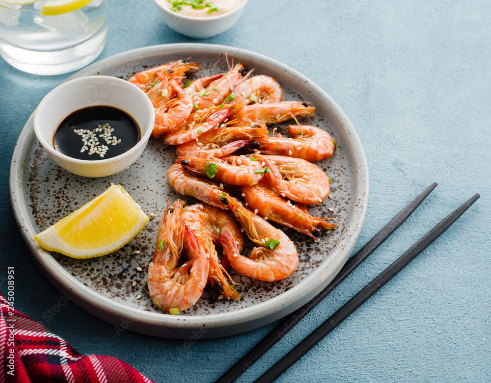 Shrimp glazed in soy sauce with green onion and lemon. Shrimp glazed in soy sauce with green onion and lemon.