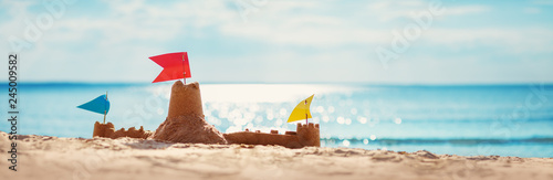 Sandcastle on the sea in summertime