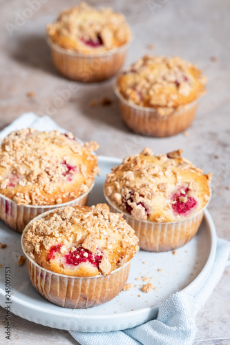Fresh homemade delicious raspberry muffins on a table