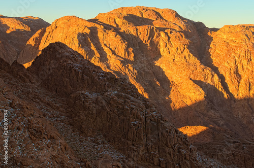 Amazing Sunrise at Sinai Mountain (Mount Horeb, Gabal Musa, Moses Mount). Beautiful view from the mountain. Sinai Peninsula of Egypt. Pilgrimage place and famous touristic destination