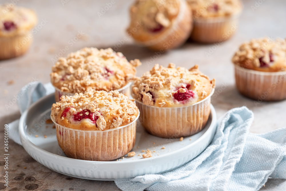 Fresh homemade delicious raspberry muffins on a table Fresh homemade delicious raspberry muffins on a table