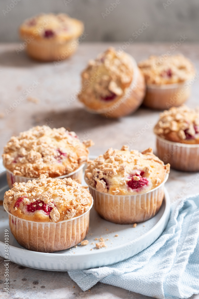 Fresh homemade delicious raspberry muffins on a table Fresh homemade delicious raspberry muffins on a table