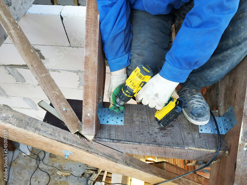 Wallpaper Mural master screwdriver screwdriver screw into a wooden board Torontodigital.ca