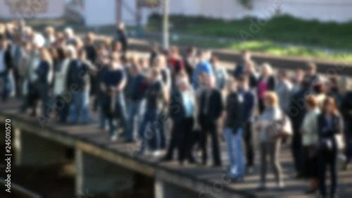 People enter the suburban train from the platform.Out of focus