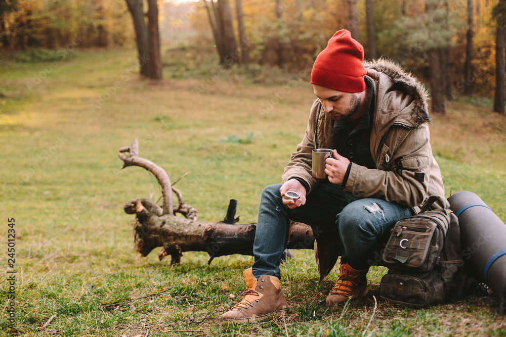 Fototapeta premium Young blogger photographer travel in mountain forest