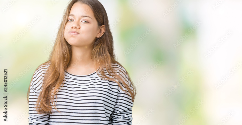 Young beautiful brunette woman wearing stripes sweater over isolated background puffing cheeks with funny face. Mouth inflated with air, crazy expression. Young beautiful brunette woman wearing stripes sweater over isolated background puffing cheeks with funny face. Mouth inflated with air, crazy expression.