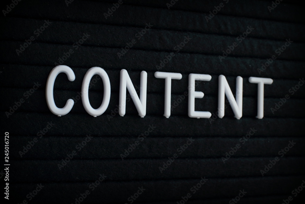 The word Content in white plastic letters on a black letter board The word Content in white plastic letters on a black letter board