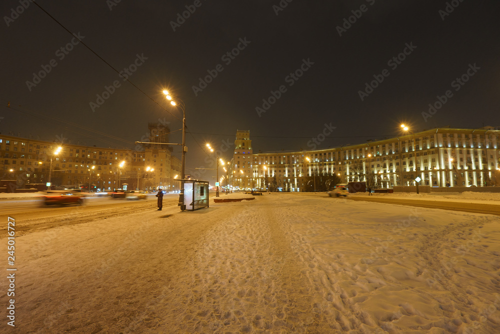 Snowy walking in winter Moscow. Blizzard time. Leninsky prospect at the winter night.