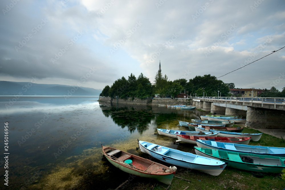 Boats on lake are tied under a bridge in Golyazi village, Bursa / Turkey