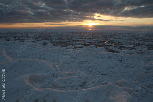 Beautiful coastal landscape Baltic Sea Latvia  Saulkrasti.  Naturally. Winter sunrise snow Baltic beach. Snow and ice 