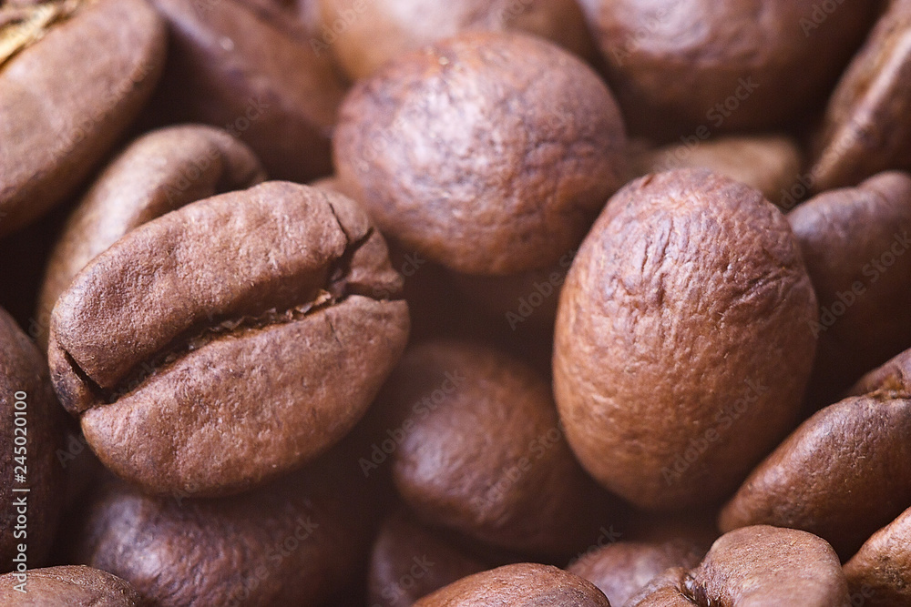 Roasted coffee beans, closeup. Background. Roasted coffee beans, closeup. Background.