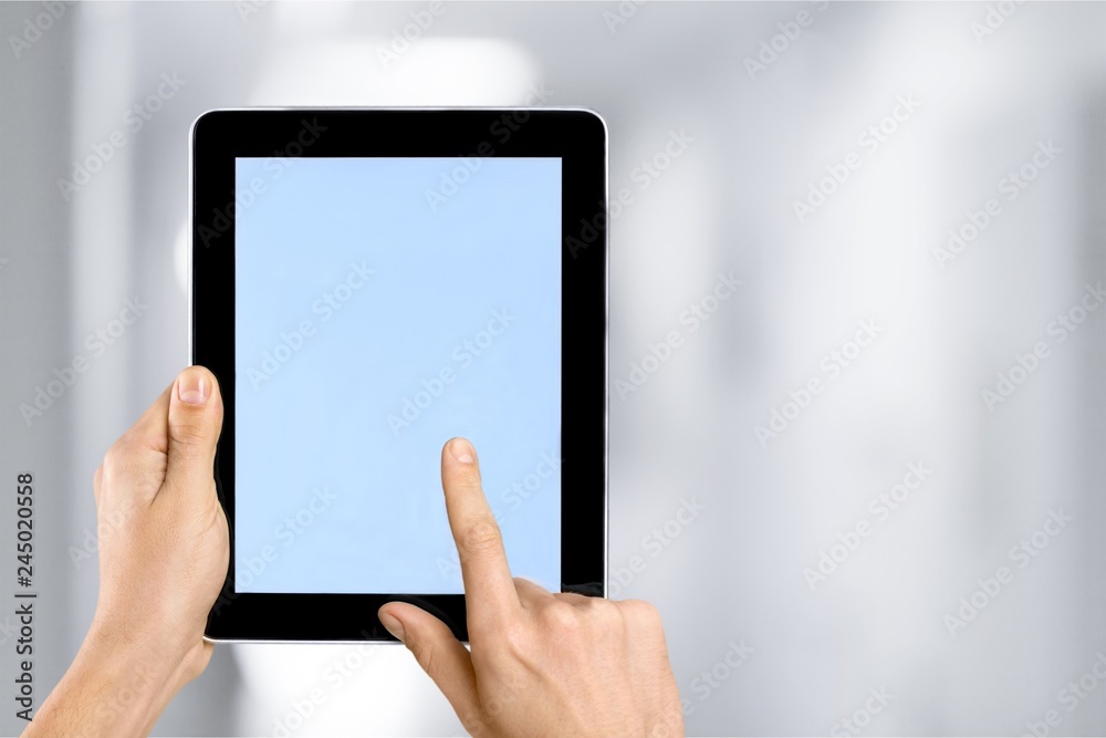 Male hands holding a tablet PC with space for you text isolated