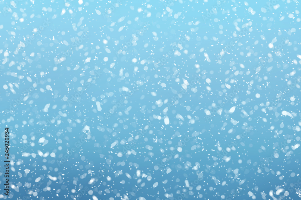 Snow falls on winter blue sky background