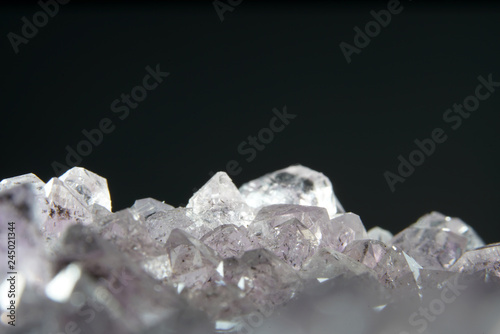 Quartz also called deep quartz photographed in studio in front of black background in Marco mode 