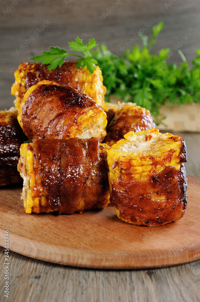 Grilled corn wrapped in bacon Grilled corn wrapped in bacon