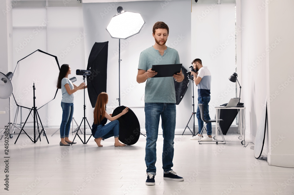 Fototapeta premium Photo studio with professional equipment and team of workers