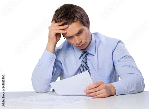 Businessman Sitting and Working with Documents - Isolated
