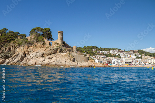 Sea view of the tower of the castle of the medieval village of Tossa de Mar, one of the most picturesque and touristic places of the Catalan Costa Brava