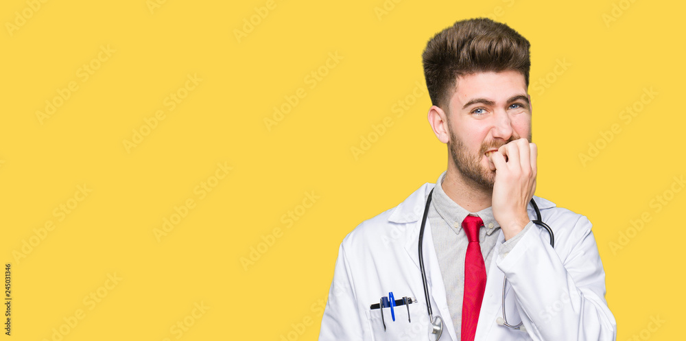 Young handsome doctor man wearing medical coat looking stressed and nervous with hands on mouth biting nails. Anxiety problem. Young handsome doctor man wearing medical coat looking stressed and nervous with hands on mouth biting nails. Anxiety problem.