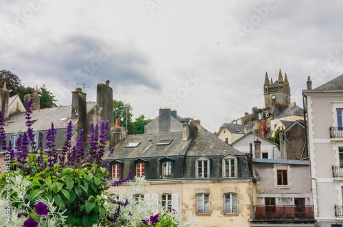 Notre-Dame de l'Assumption above Quai Brizeux at Quimperle. Finistere, Brittany, France photo