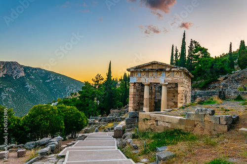 Sunset view of Athenian treasury at the ancient delphi site in Greece