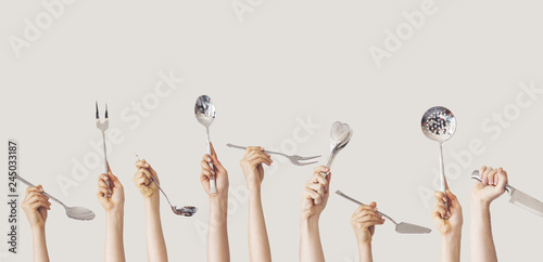 Hands holding kitchen equipment on isolated background