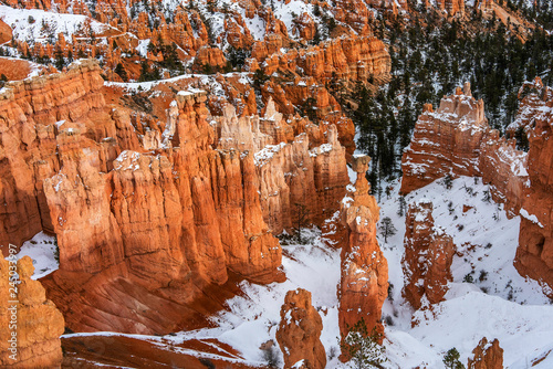 Sandstone formation, in the snow, in a canyon basin.