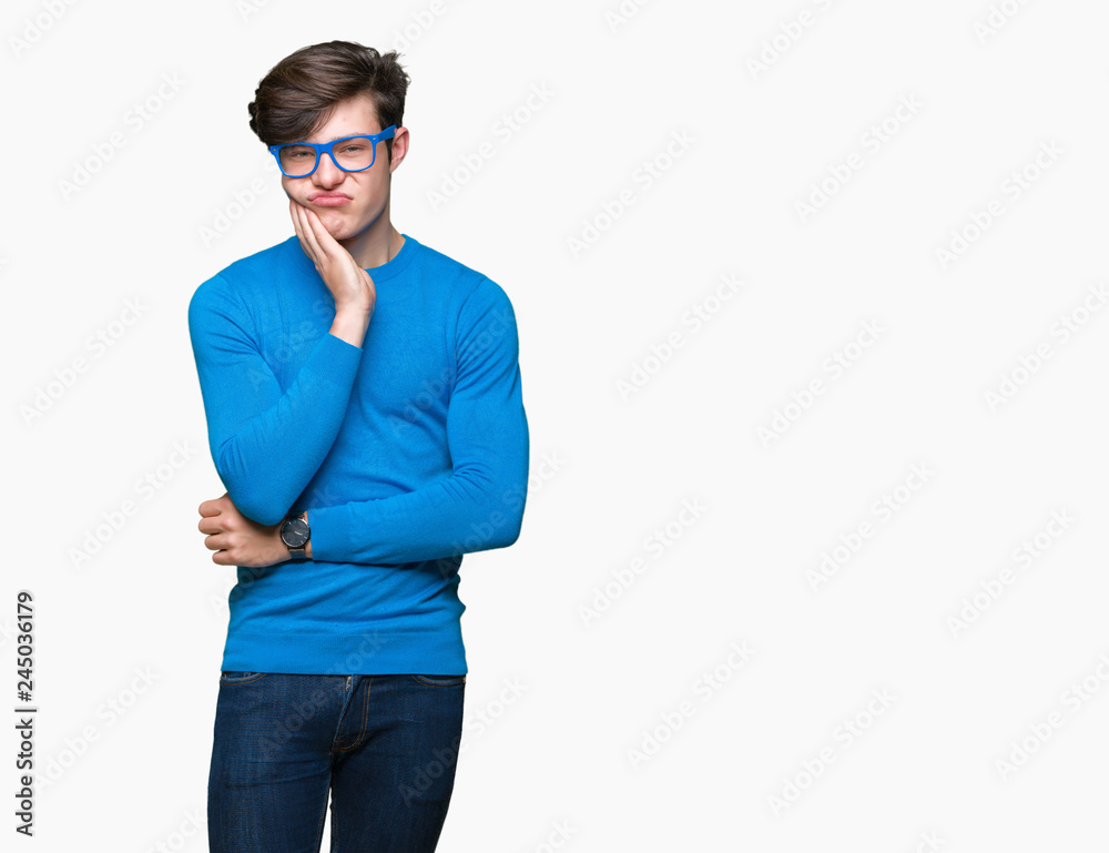 Young handsome man wearing blue glasses over isolated background thinking looking tired and bored with depression problems with crossed arms. Young handsome man wearing blue glasses over isolated background thinking looking tired and bored with depression problems with crossed arms.