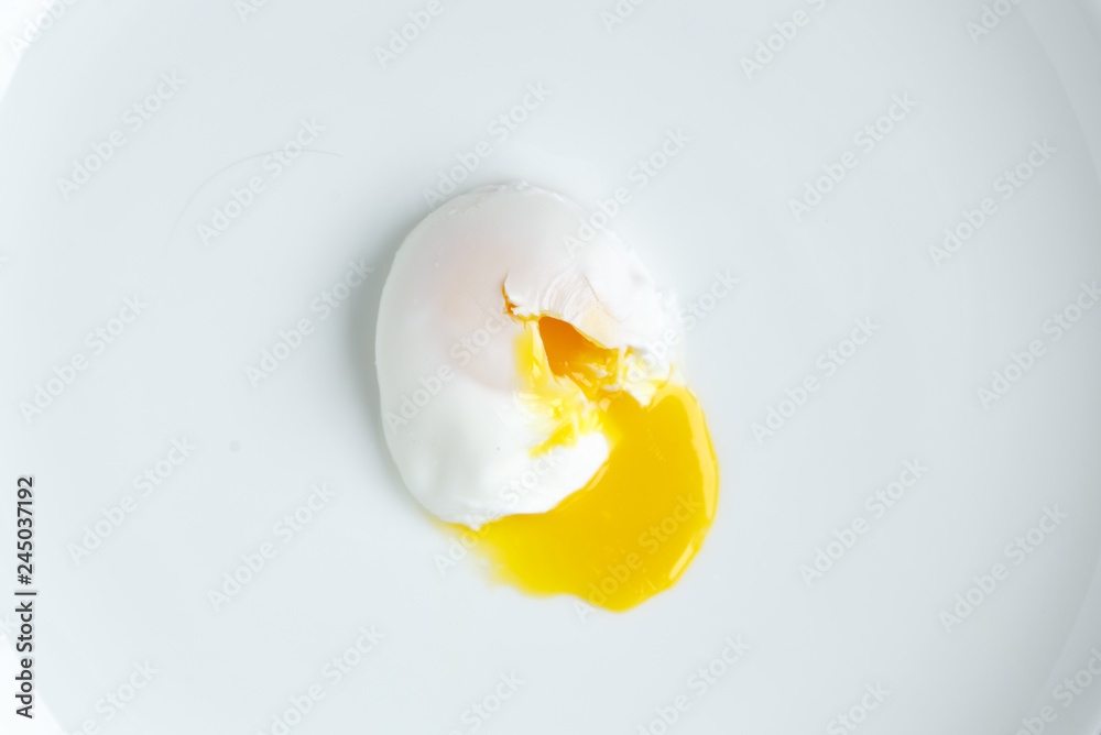 poached egg closeup shot on white background - obrazy, fototapety, plakaty 