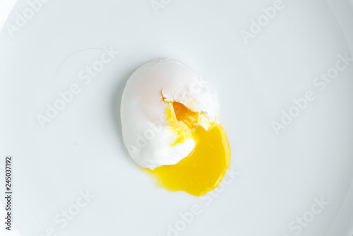 poached egg closeup shot on white background