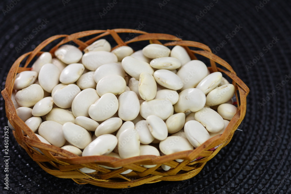 white beans in a wicker basket white beans in a wicker basket