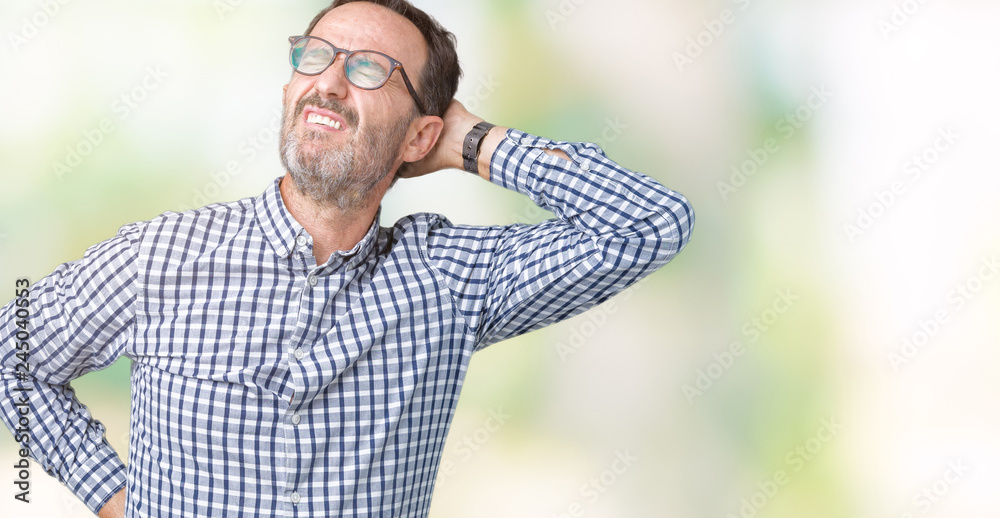Handsome middle age elegant senior man wearing glasses over isolated background Suffering of neck ache injury, touching neck with hand, muscular pain