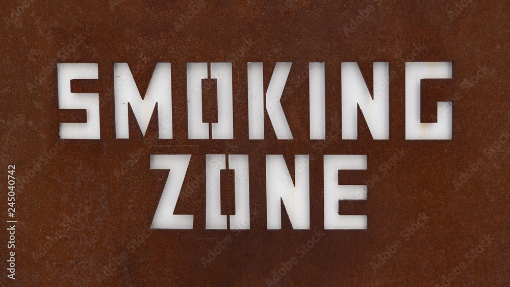 Sign of smoking zone. Close up of designated smoking area sign. For peace of mind to separate the smokers from the non-smoking zone. Sign of smoking zone. Close up of designated smoking area sign. For peace of mind to separate the smokers from the non-smoking zone.