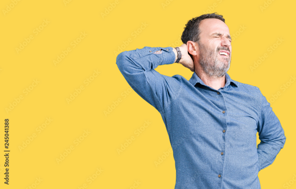Handsome middle age elegant senior man over isolated background Suffering of neck ache injury, touching neck with hand, muscular pain Handsome middle age elegant senior man over isolated background Suffering of neck ache injury, touching neck with hand, muscular pain