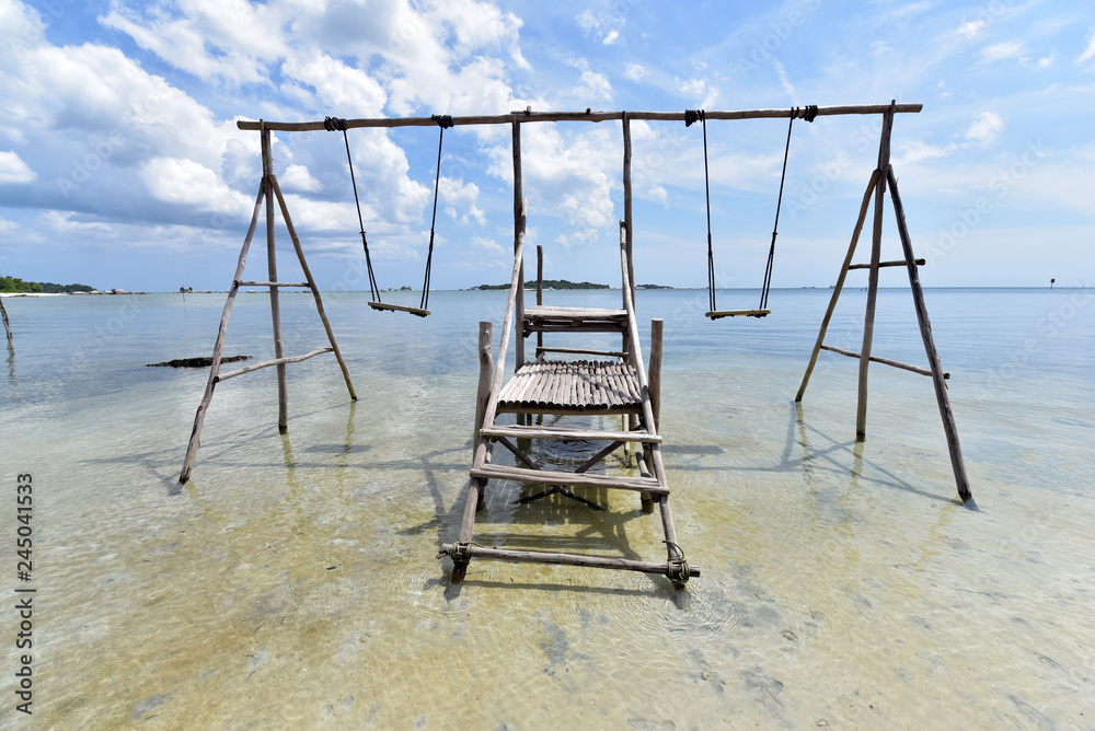 Fototapeta premium An empty swing at the beach of Tanjung Kelayang, Belitung Island, Indonesia