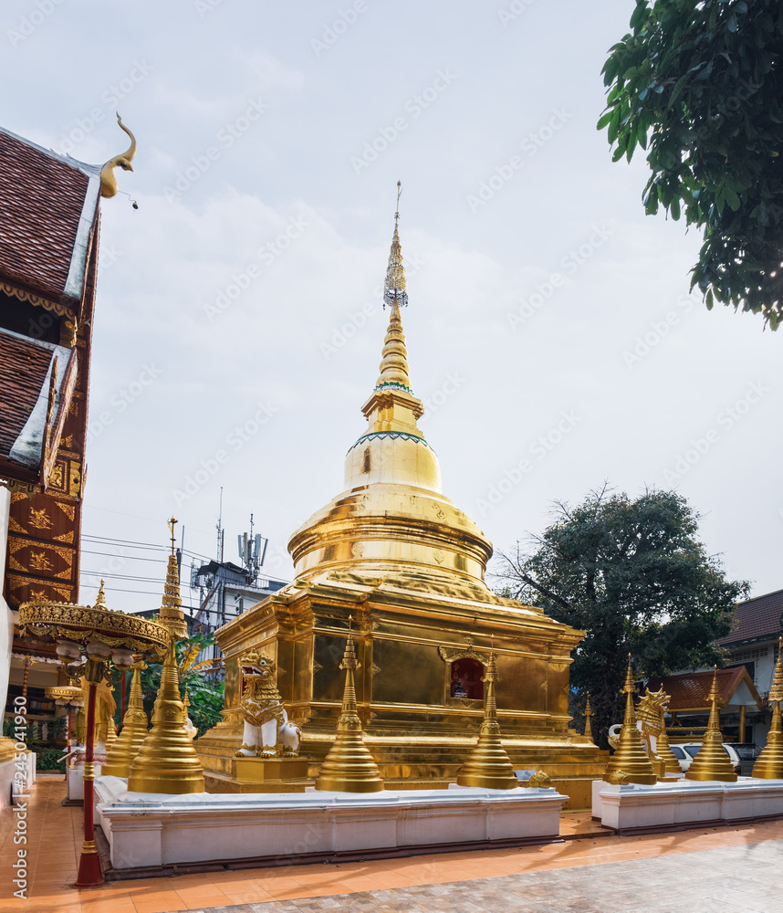 Naklejka premium Typical Golden stupa of the Wat Phra Sing in Chiang Rai, northern Thailand.