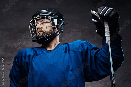 Photography Portrait of a professional ice-hockey player in a hockey uniform