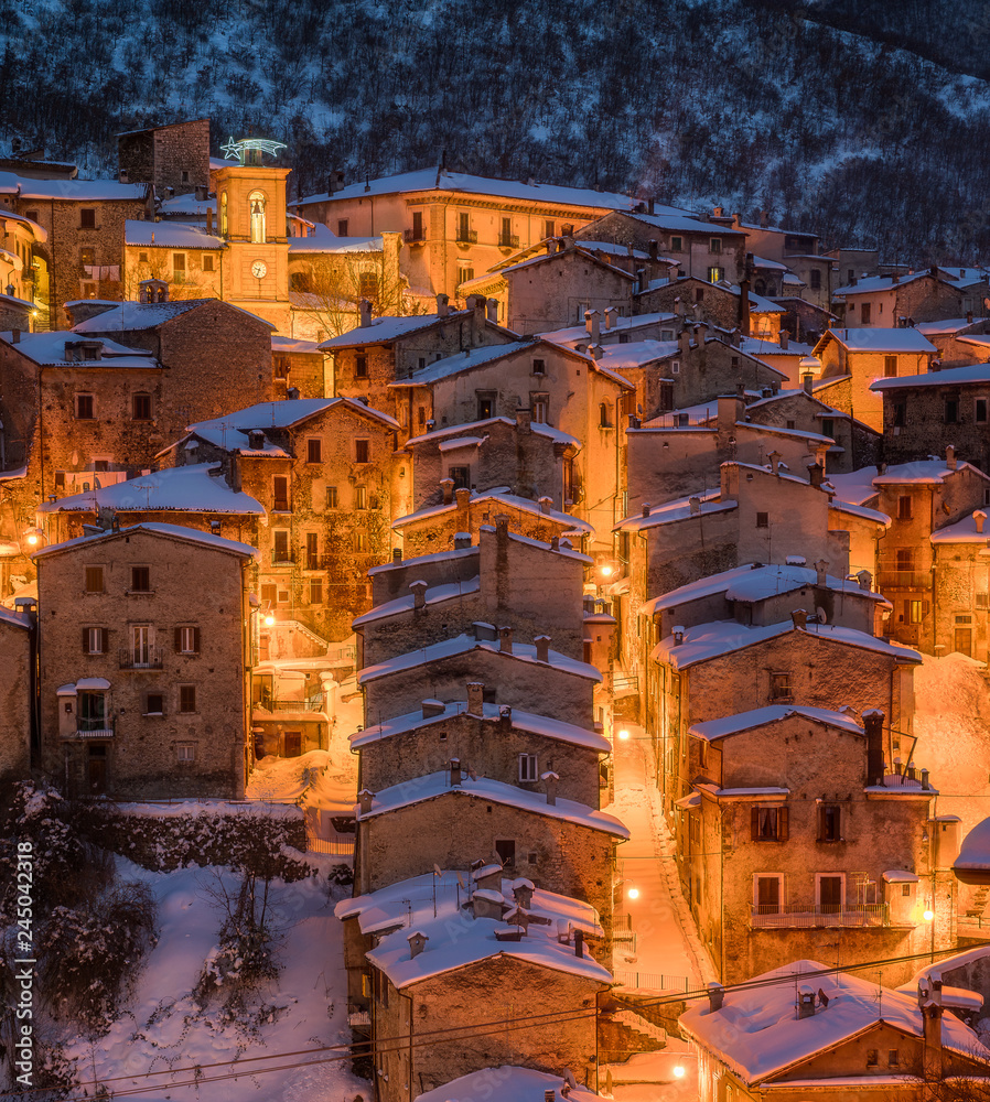 The beautiful Scanno covered in snow during a cold winter evening. Abruzzo, central Italy.