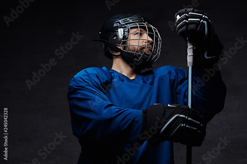 Photography Portrait of a professional ice-hockey player in a hockey uniform