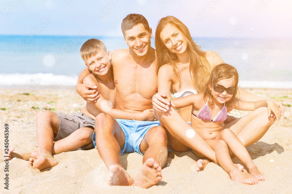 Happy family on vacations on beach