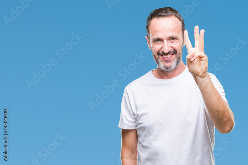 Middle age hoary senior man wearing white t-shirt over isolated background showing and pointing up with fingers number three while smiling confident and happy.