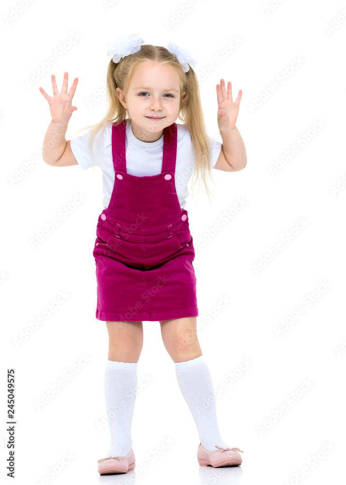 Little girl posing in studio on a white background. Little girl posing in studio on a white background.