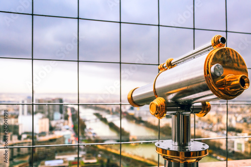 Fotografie Vintage coin operated binocular overlooking for Paris from top of Eiffel Tower